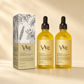VAIRE BEAUTY rosemary hair growth oil duo with box on warm ivory studio background