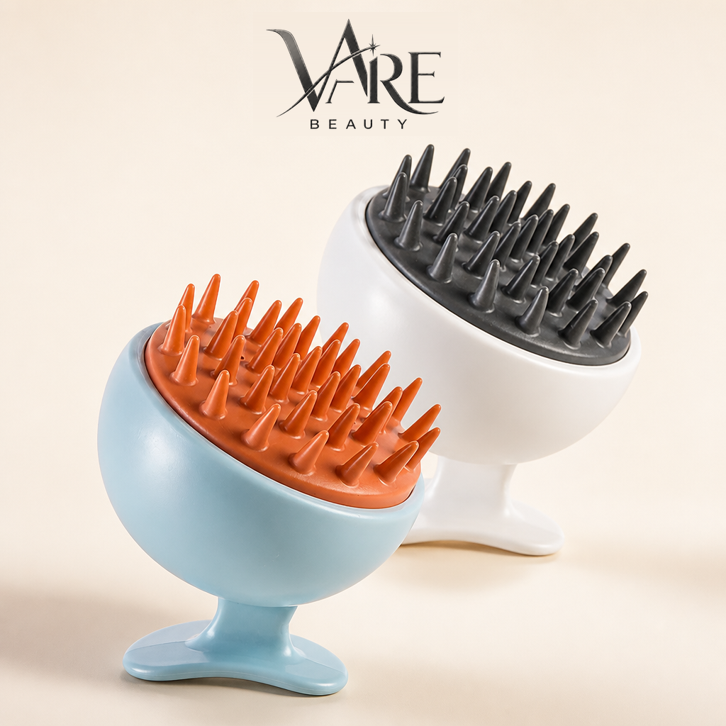 VAIRE BEAUTY scalp massager duo on warm ivory studio background